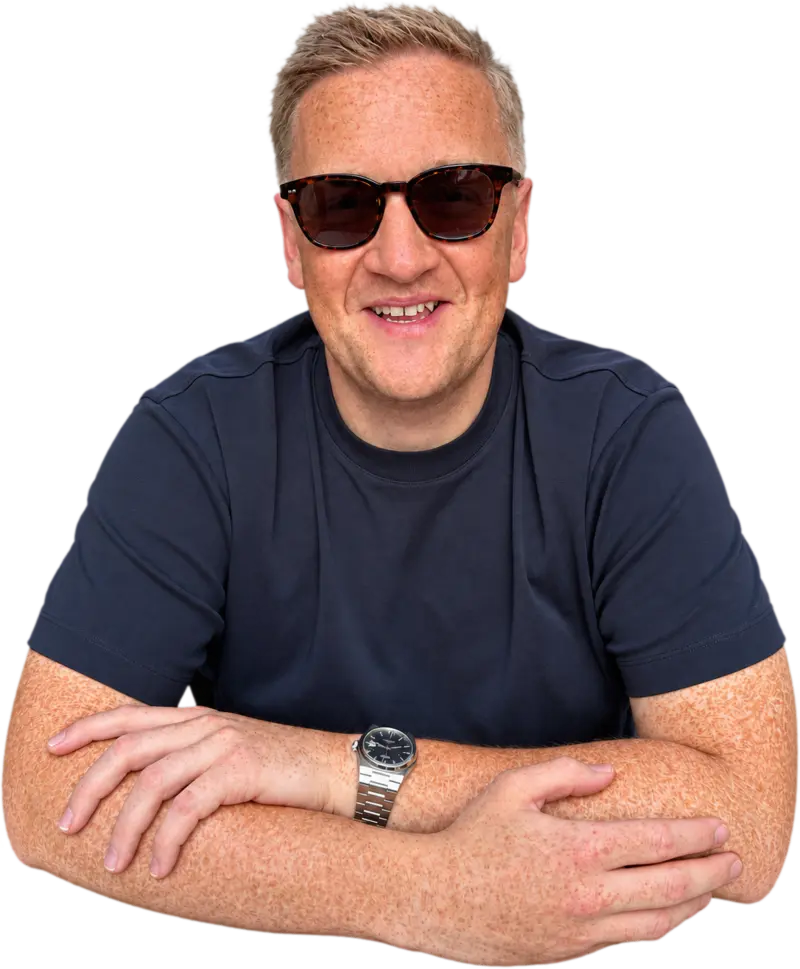 Chris Palmer in sunglasses, leaning on the chat window with his arms crossed